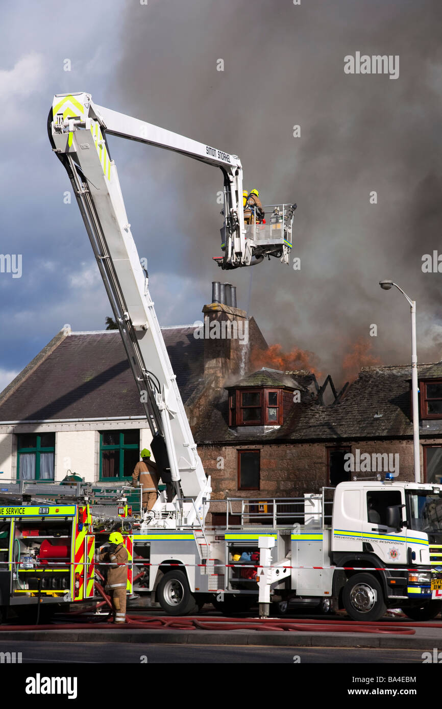 Firemen fighting Shop fire at George Strachan’s of Aboyne, Aberdeenshire, Scotland, UK, Europe, EU Stock Photo
