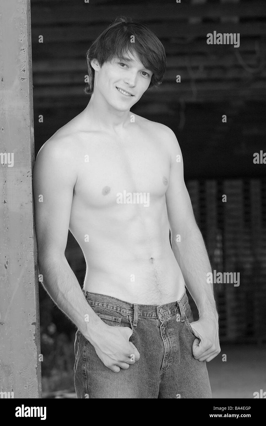 Man young upper bodies freely smiles detail s/w series people 20-30 years  brunette gaze camera jeans nonchalant cool casual Stock Photo - Alamy