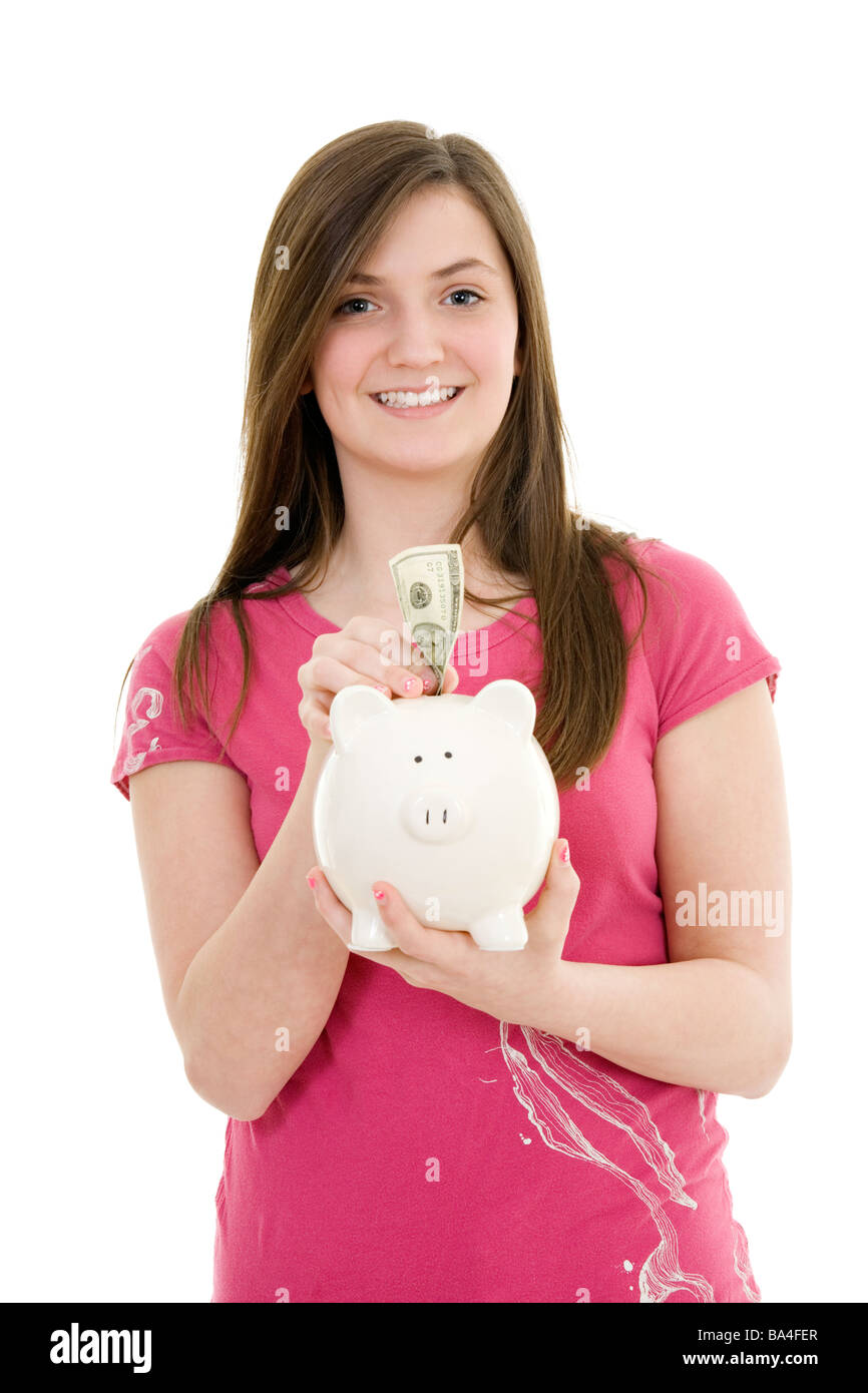 Caucasian teenager holding a piggy bank on white background Stock Photo ...