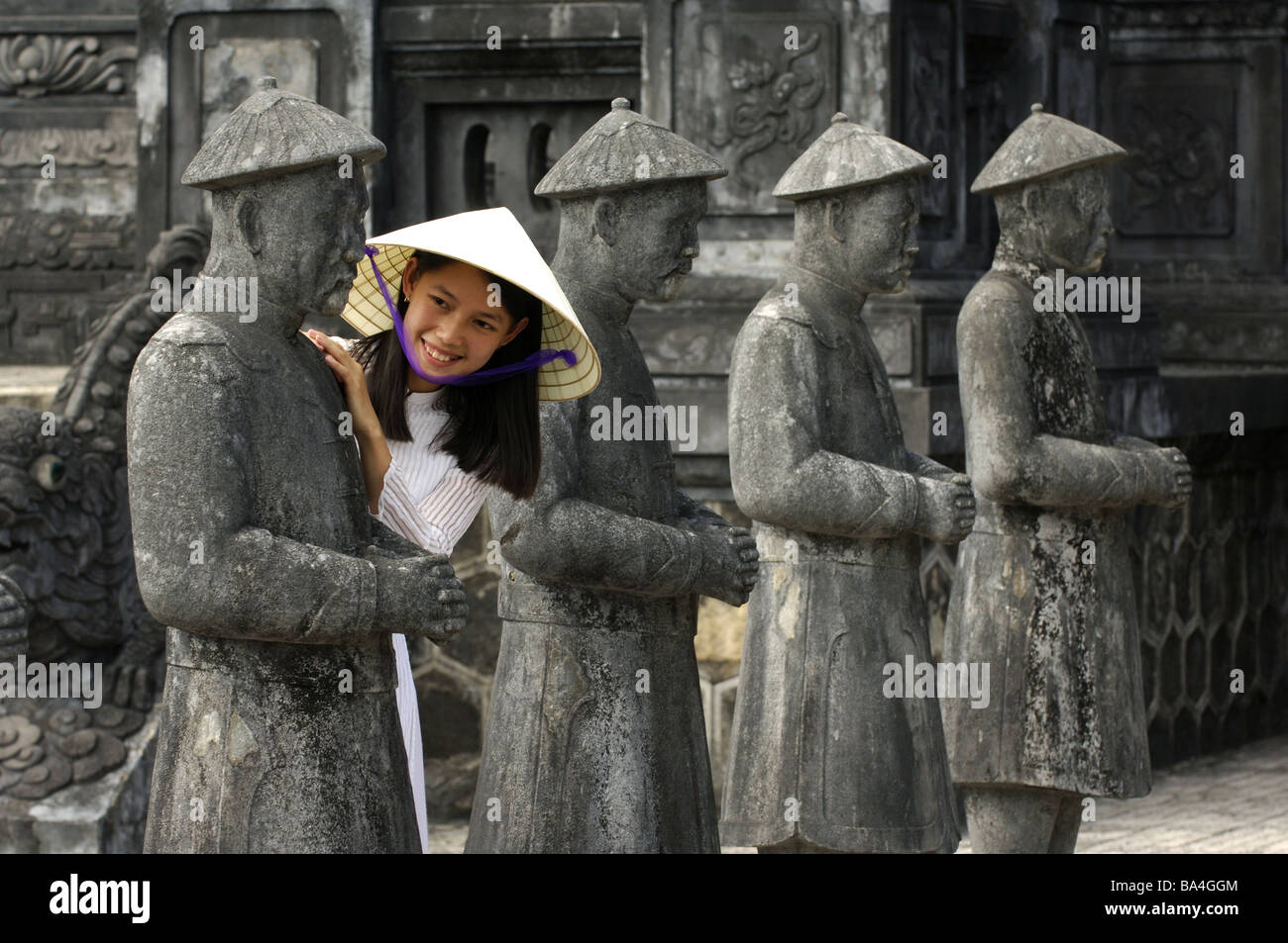 Vietnam Hue woman cheerfully statue smiles no models southeast-Asia city  people Asian release Asia kindly Vietnamese hat Stock Photo - Alamy