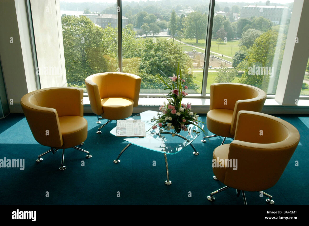four chairs in the waiting area overlooking a park at Anglo Irish Bank in the Atrium in Waterford Stock Photo