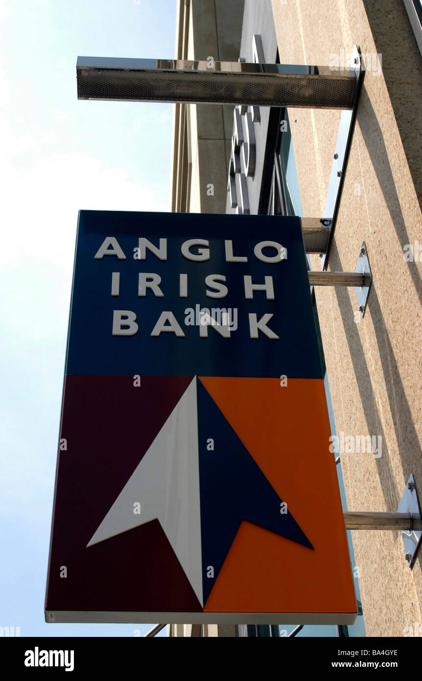The side of a branch of Anglo Irish Bank with a sign outside hanging on the wall. Stock Photo