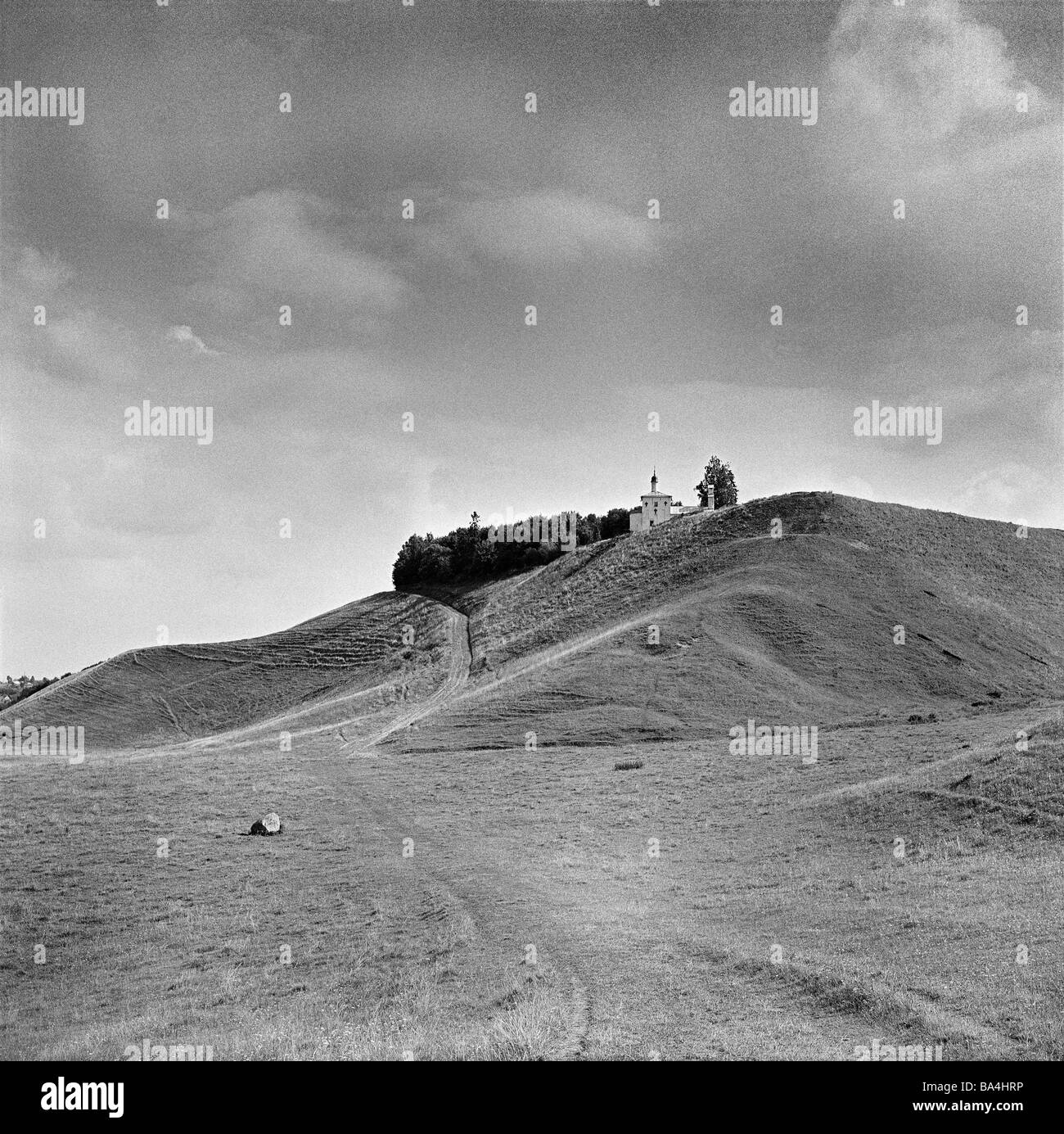 Russia region Pleskau Izborsk hills church s/w northwest-Russia northwest Russian lowland landscape hill-landscape way place of Stock Photo