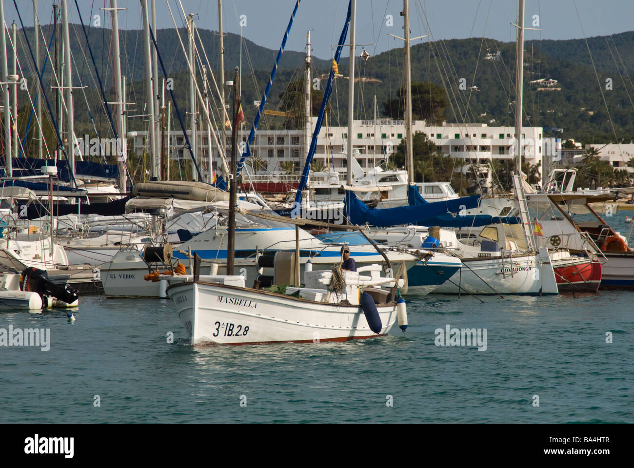 Traditional ibizan fishing boat entering the harbour Stock Photo - Alamy