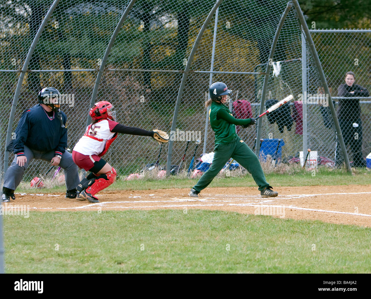 A batter, catcher and umpire at a girls highschool softball game Stock Photo Alamy