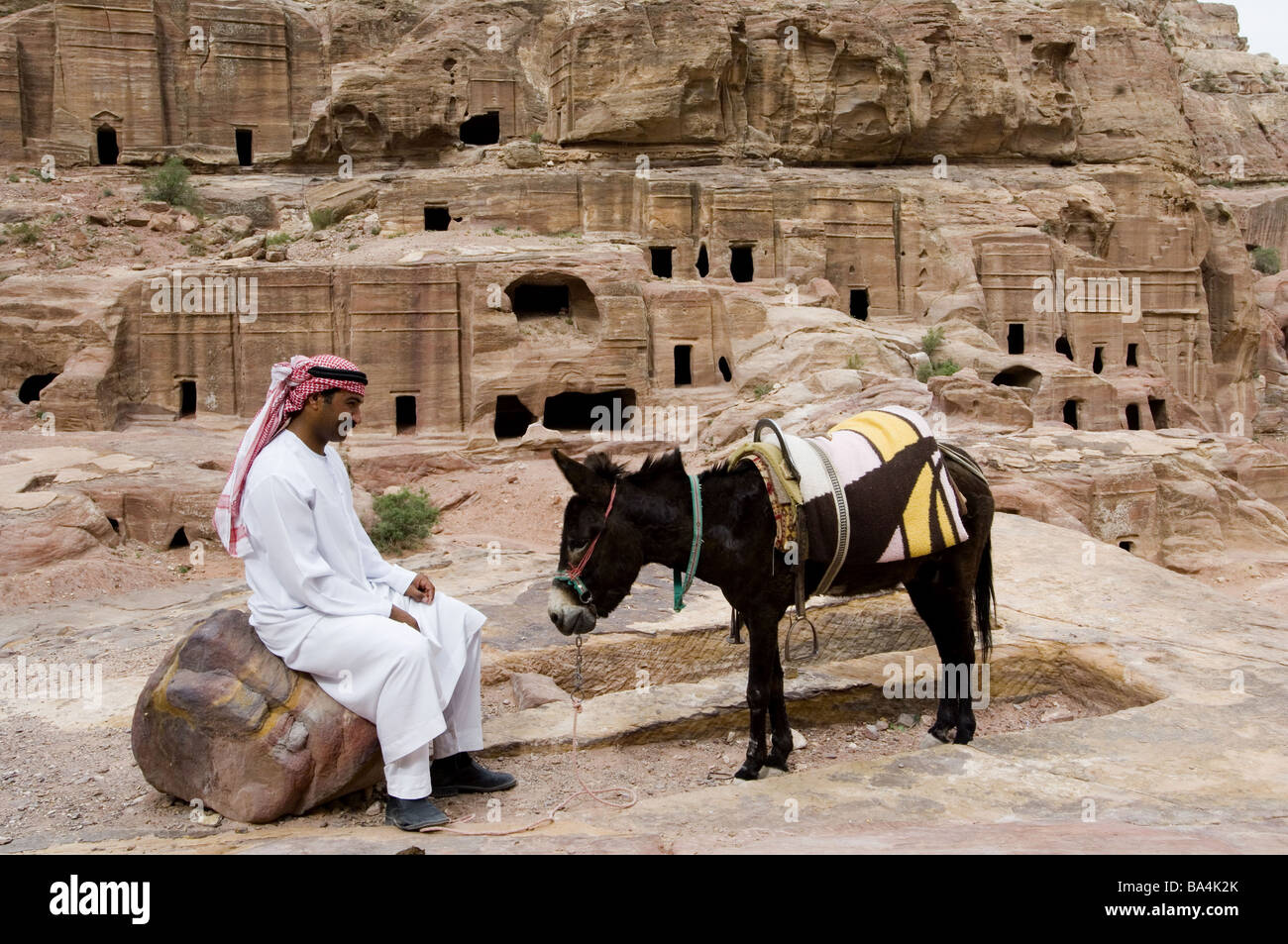 Jordan Petra rock-diggers stone man sits donkeys no models East-Jordan-country Edom city rock-city release Near east Stock Photo