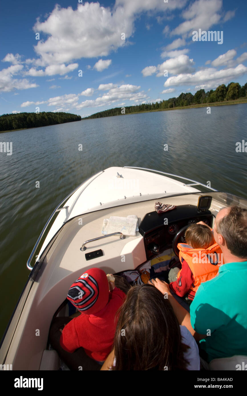 Family on a boat-trip in Lake Hjalmaren,Sweden Stock Photo