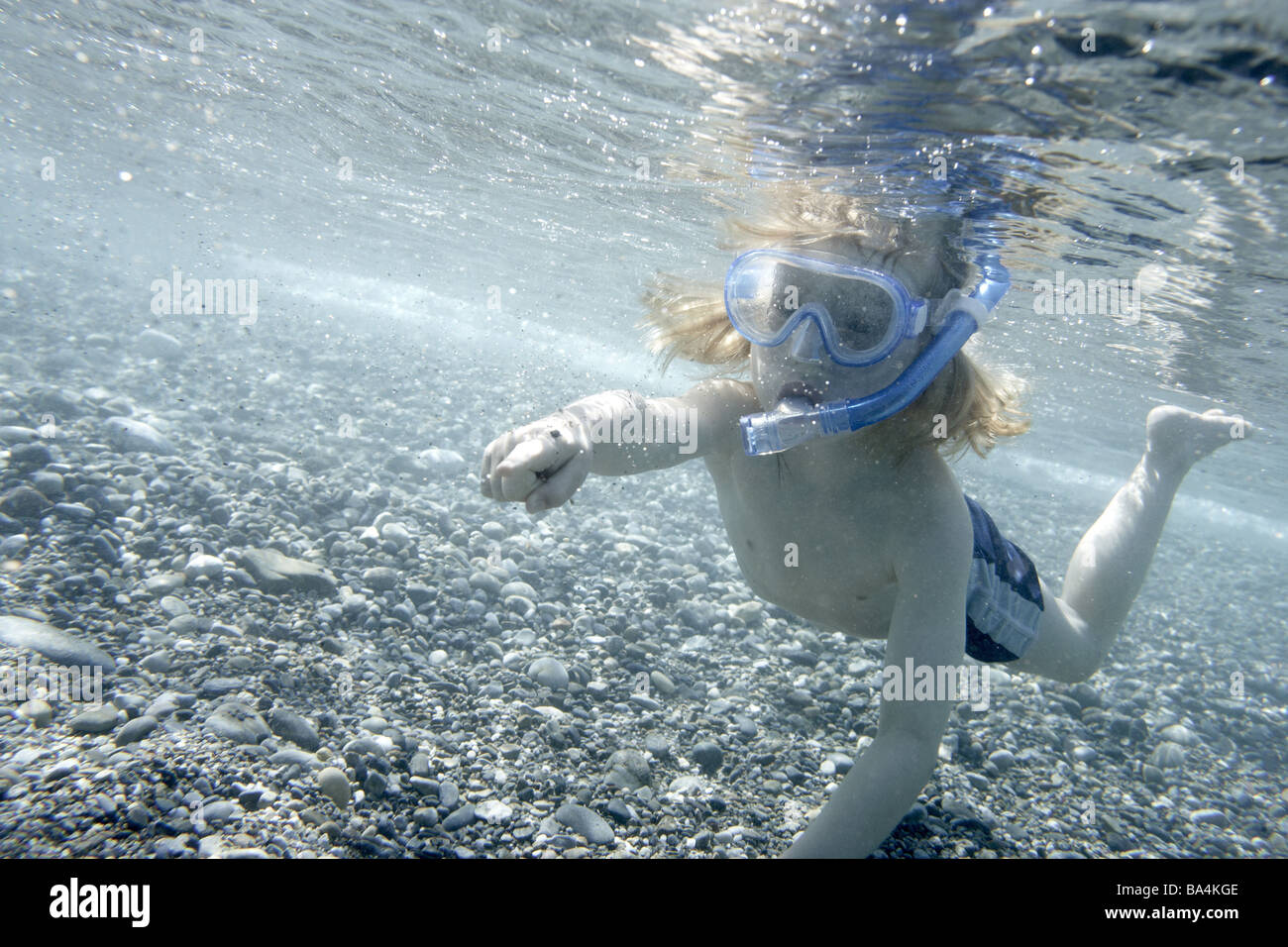Sea underwaterreception child snorkels gesture shows series people child 5 years snorkel