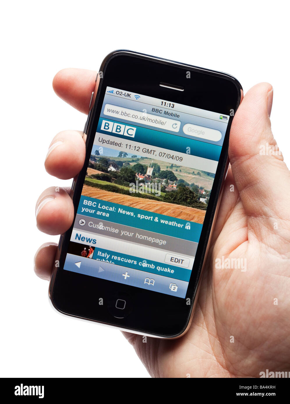 Male hand holding an iPhone showing the BBC Mobile website portal Stock Photo