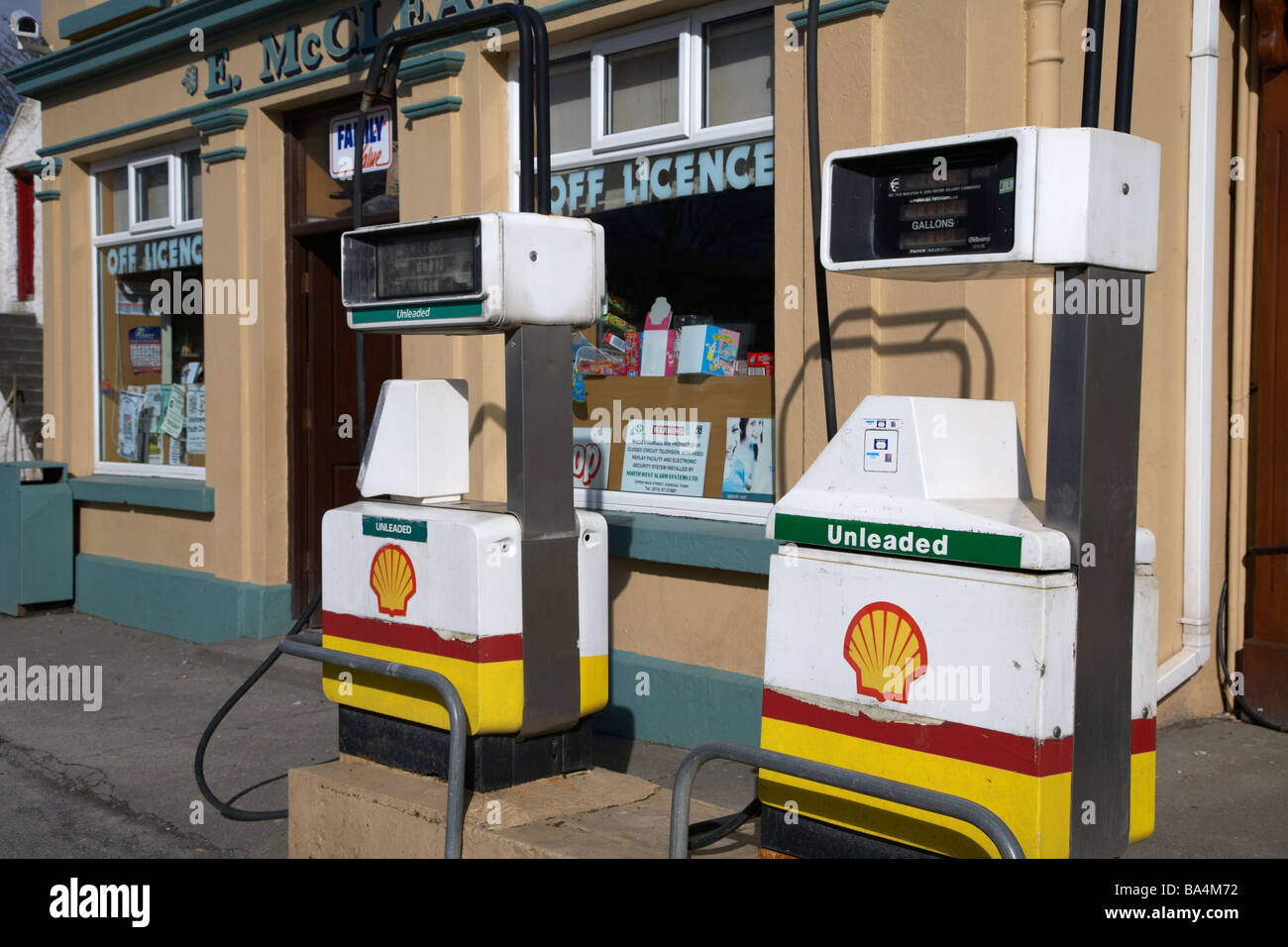 petrol gas pumps on the street outside mccleans combined bar shop