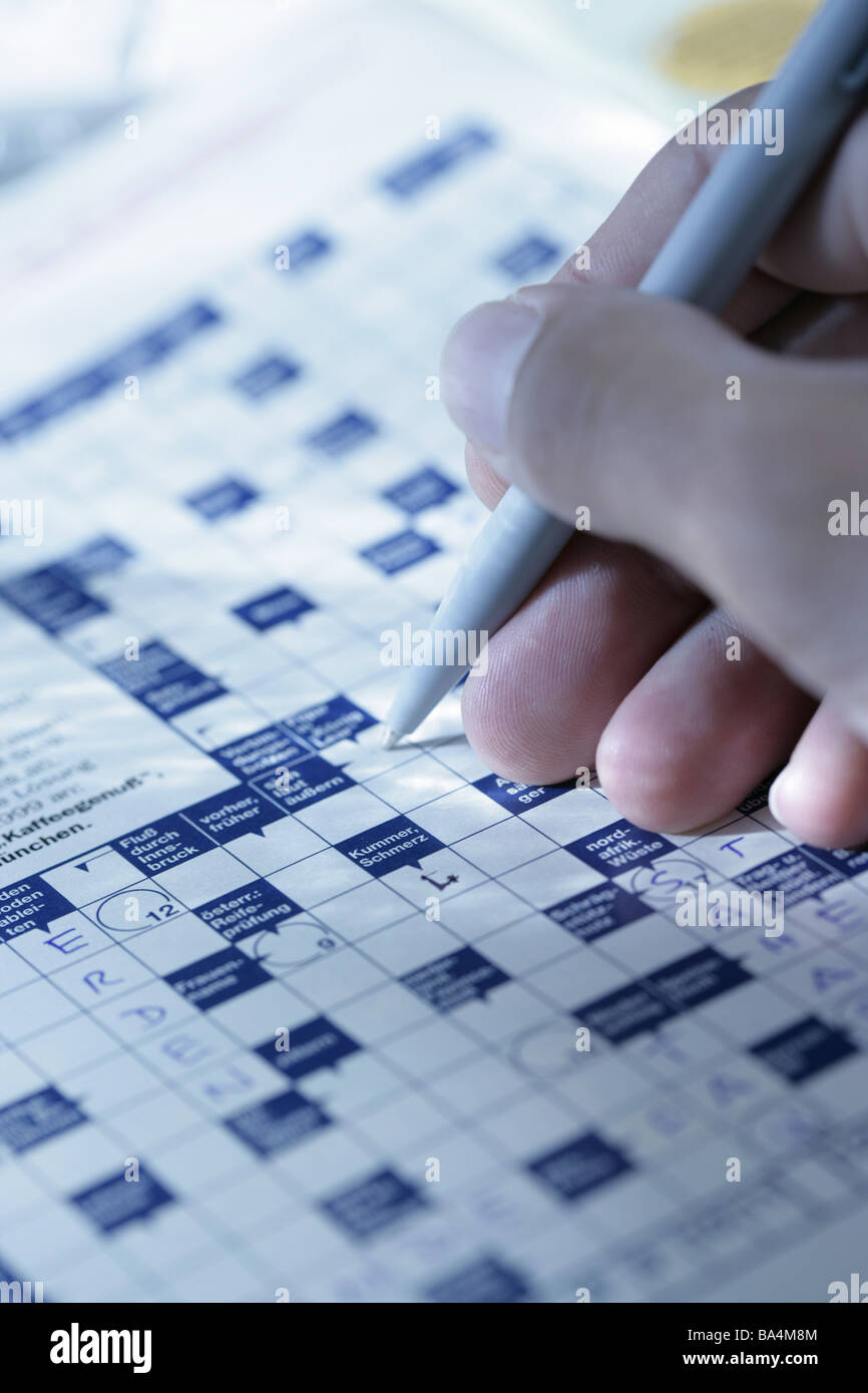 Men'shand detail ballpoint pens crossword puzzles man solves hand