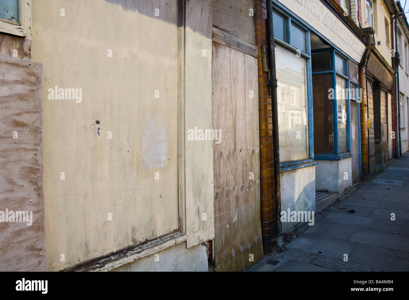 Boarded up shops in former coal mining village of Six Bells Blaenau Gwent in the South Wales Valleys UK Stock Photo