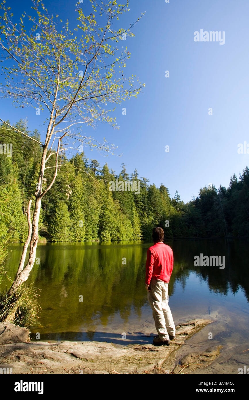 Person standing by lake - Larrabee State Park, Washington Stock Photo