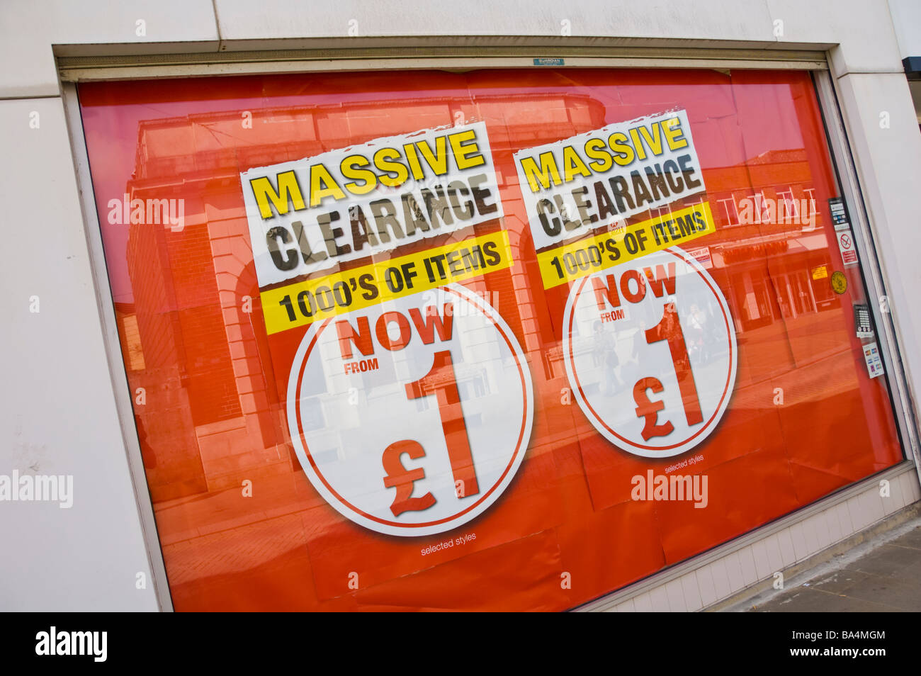 MASSIVE CLEARANCE sale poster in shop window Ebbw Vale South Wales UK