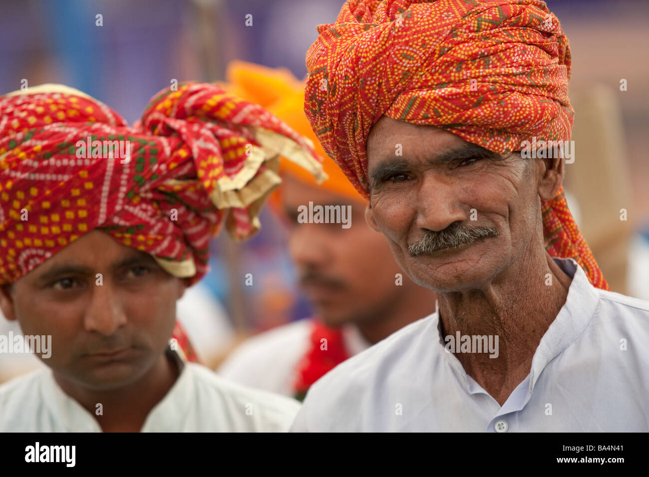Turbaned Rajasthani musicians preparing to play at a rally in Palwal Haryana India during election preparations. Stock Photo