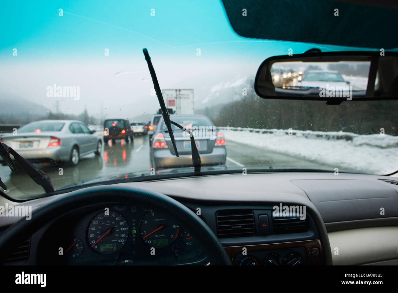 Driving in bumper to bumper traffic through the mountains in a rain ...