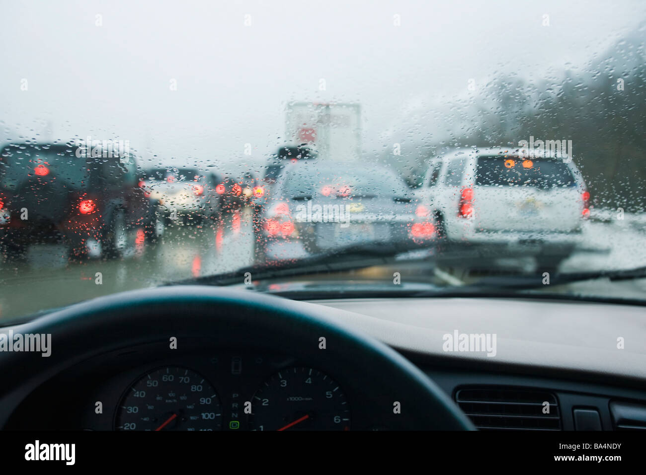 Driving in bumper to bumper traffic through the mountains in a rain