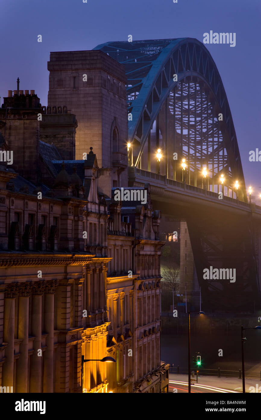 Tyne bridge and city street at night, Newcastle, Gateshead, England. Stock Photo