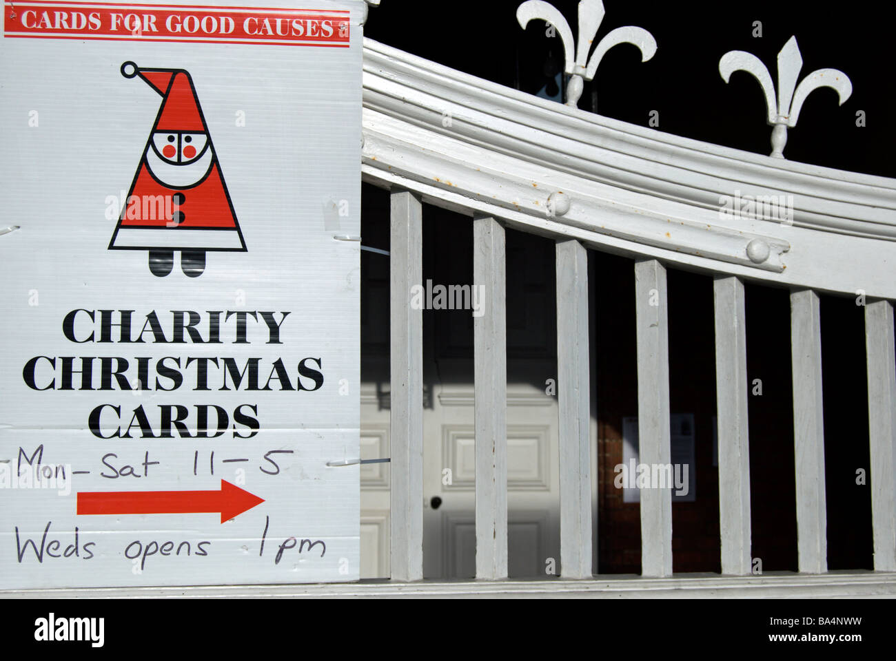 british charity christmas cards sale sign on a gate with fleurdelys