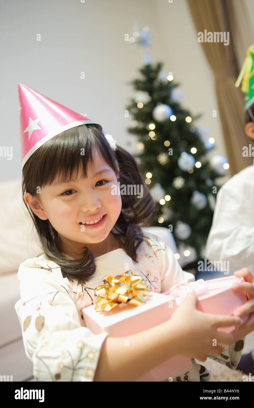 Japanese girl holding her birthday present Stock Photo