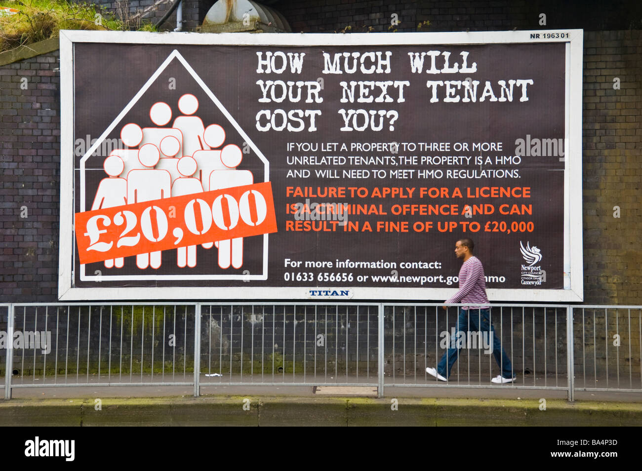 Titan advertising billboard for landlords with houses of multiple occupation on hoarding in Newport South Wales UK Stock Photo