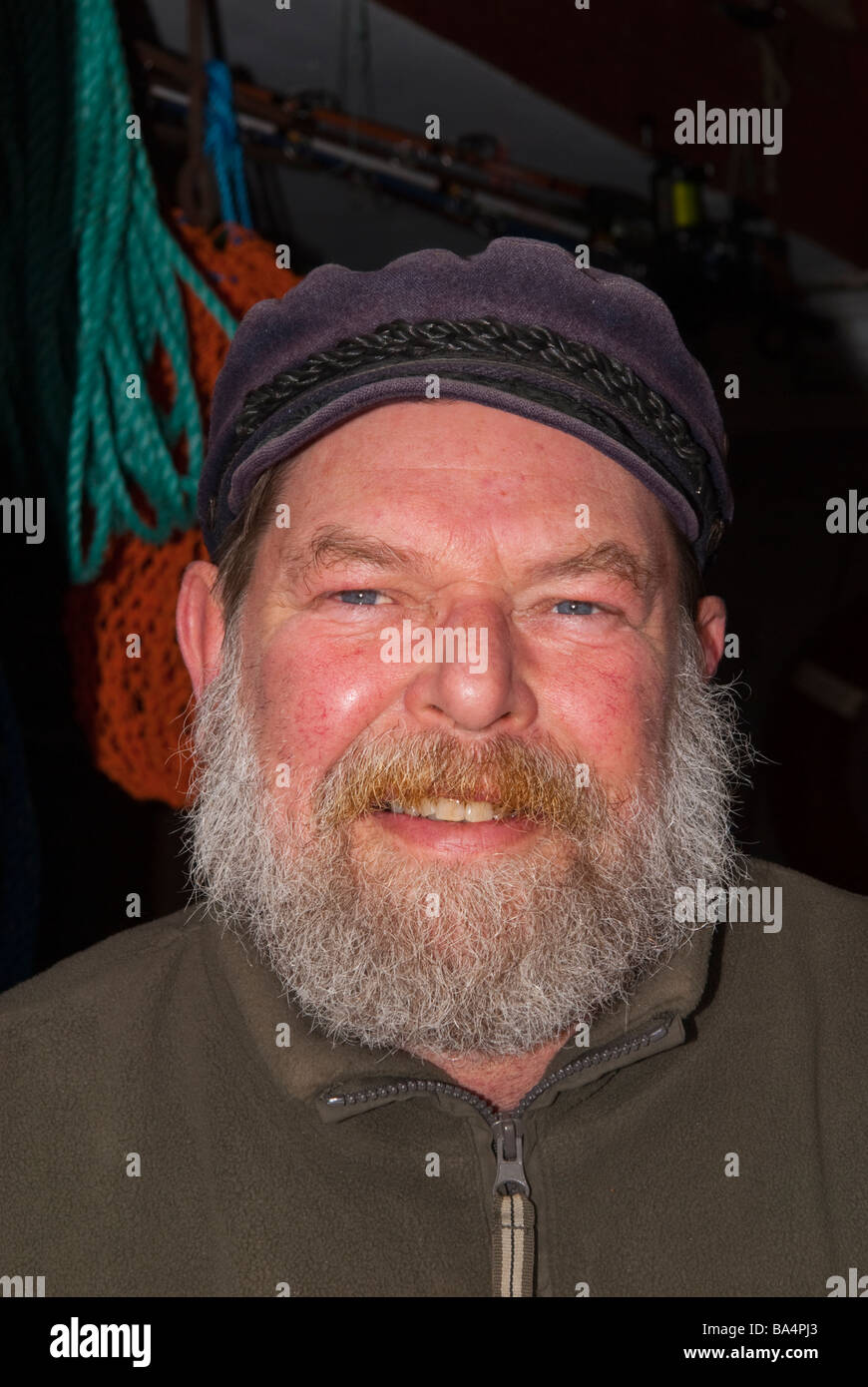 A portrait of a local fisherman who sells shellfish from a hut on the