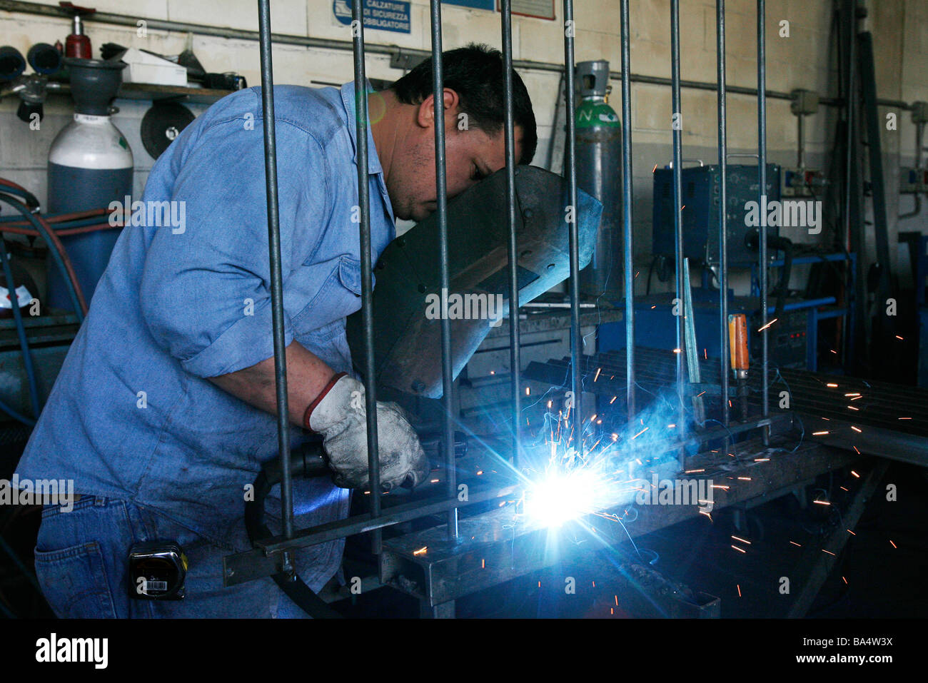 Man at work as welder near Milan, Italy Stock Photo Alamy