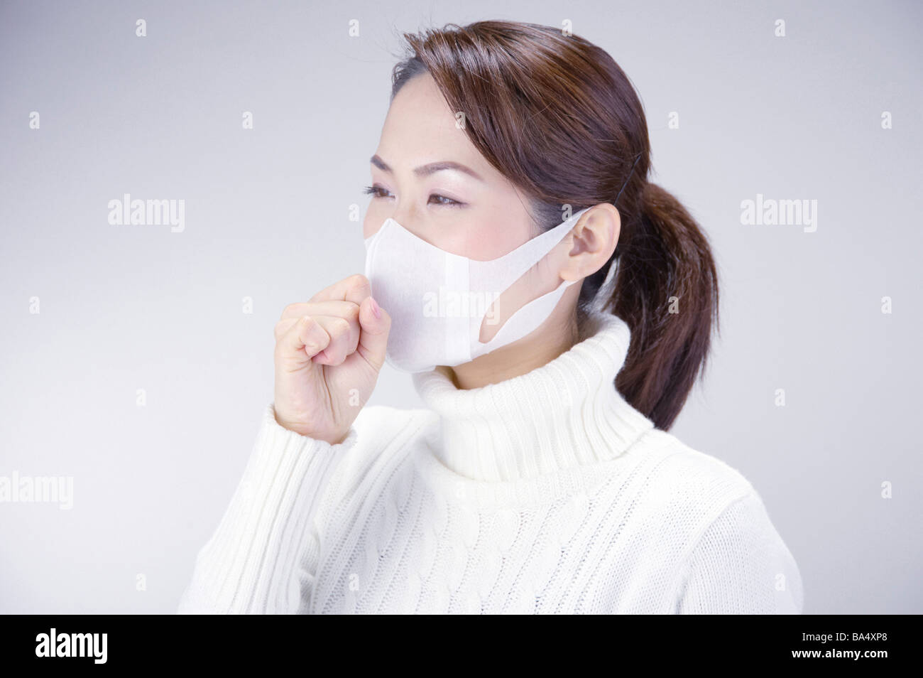 Young Woman Wearing Face Mask Stock Photo