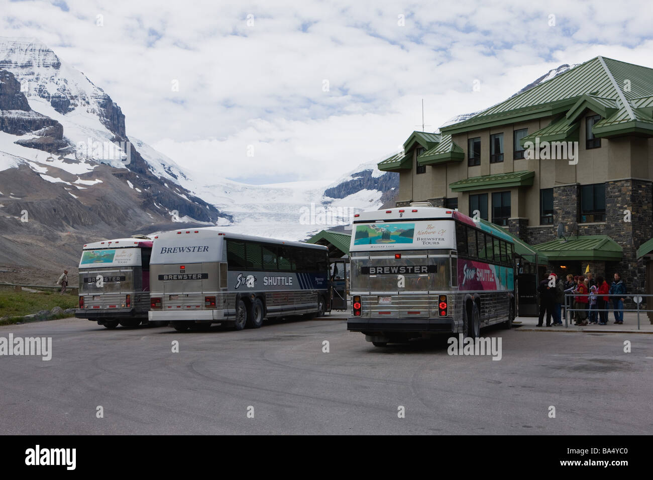 Tourists  Standing Near  Columbia Ice Field in Canada Stock Photo