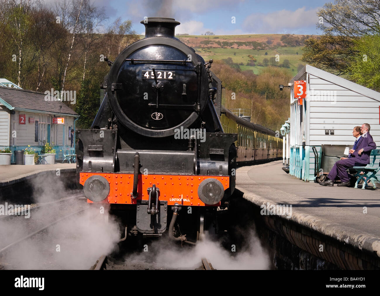 A tea break for the driver and fireman of this steam train at Grosmont station Stock Photo