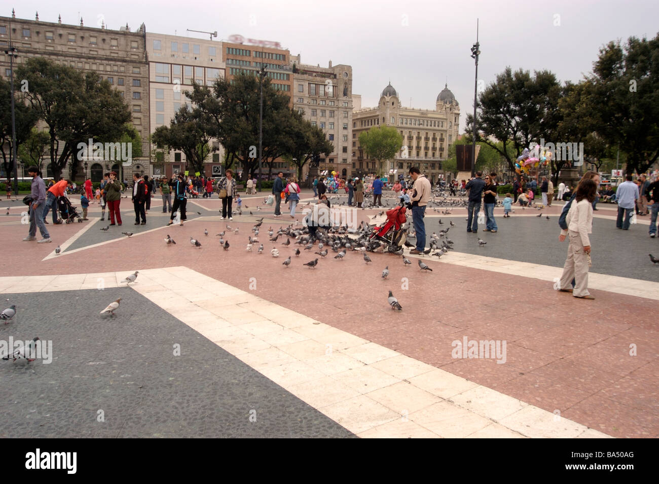 The square in Barcelona with people and pigeons Stock Photo