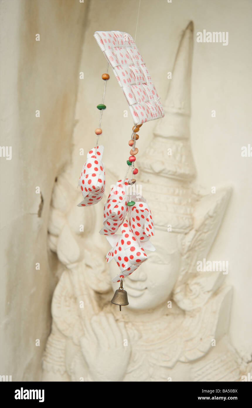Close up of red dotted paper mobile offering Wat Arun temple Bangkok Stock Photo