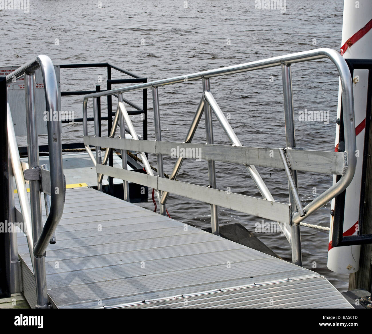 passenger boat ramp for ship on river, silver with metal walkway