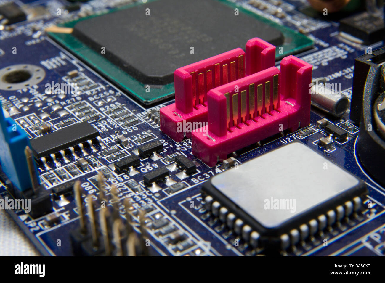 Computer motherboard detail with SATA connectors. Stock Photo
