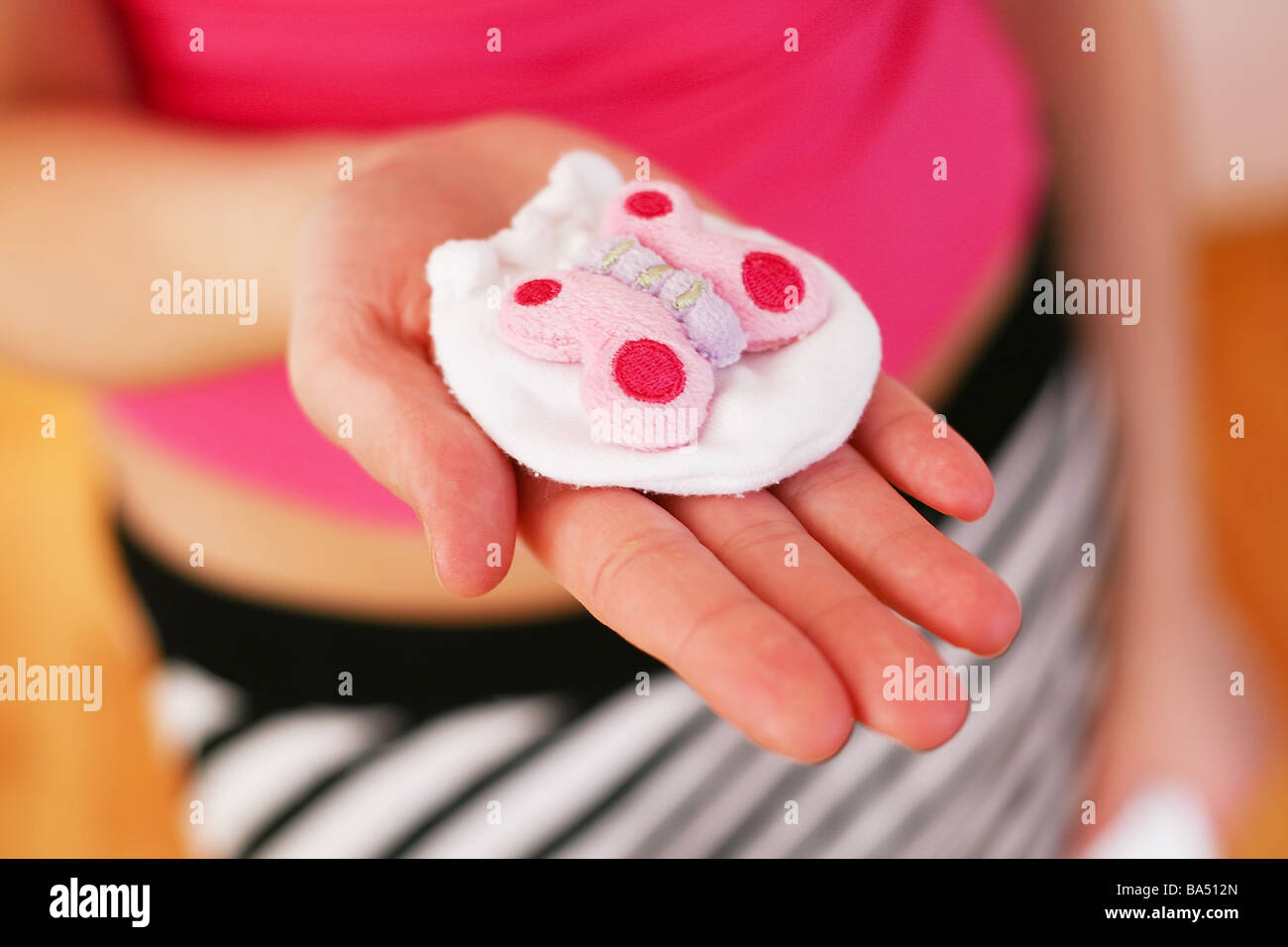 Baby clothes mitten Stock Photo Alamy