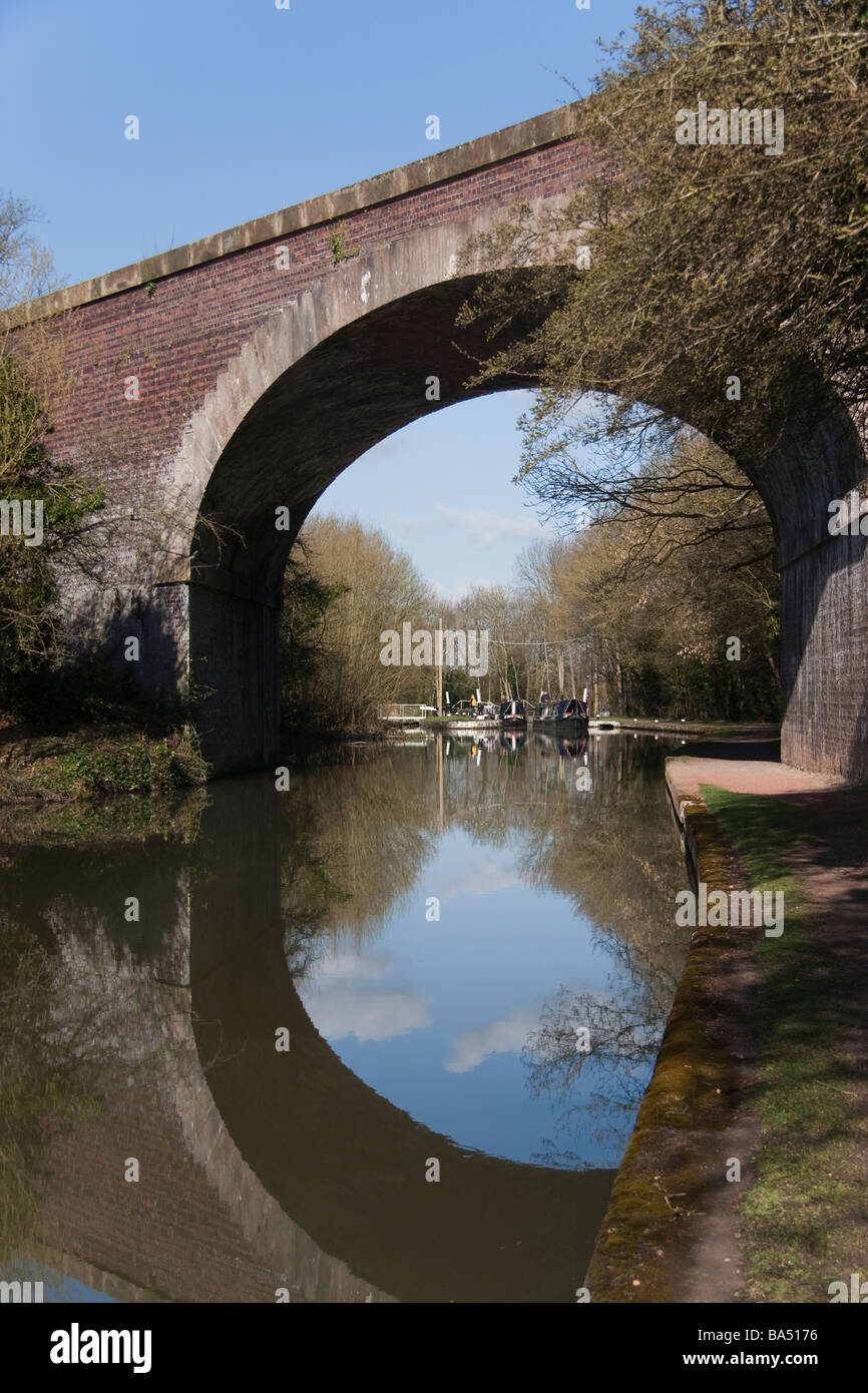 Canal Reflections Bridge break sky blue green trees Stock Photo