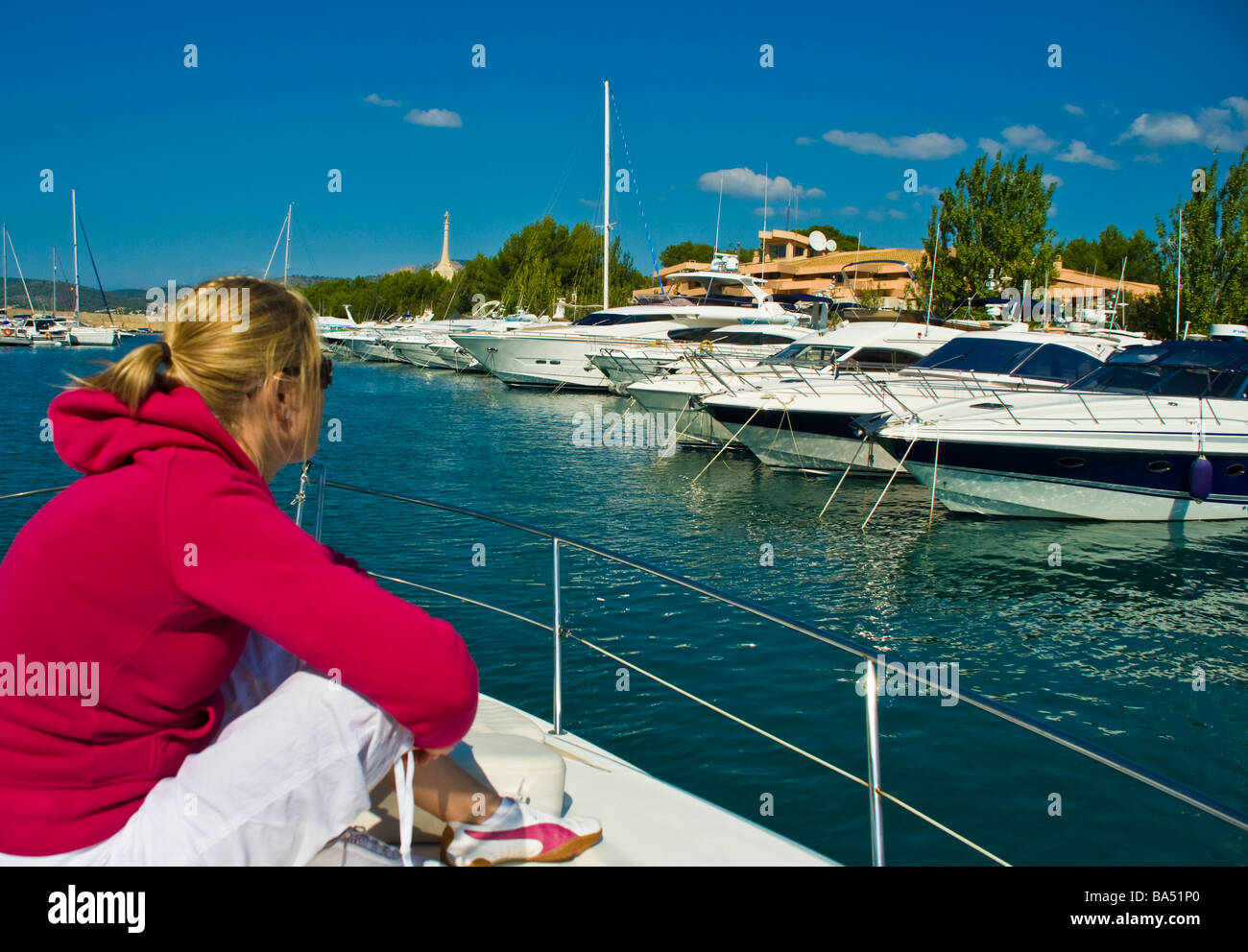 Girl looking at Yachts in harbor of Santa Ponca Majorca Baleares Spain | Mädchen Yachten Hafen von Santa Ponsa Mallorca Stock Photo