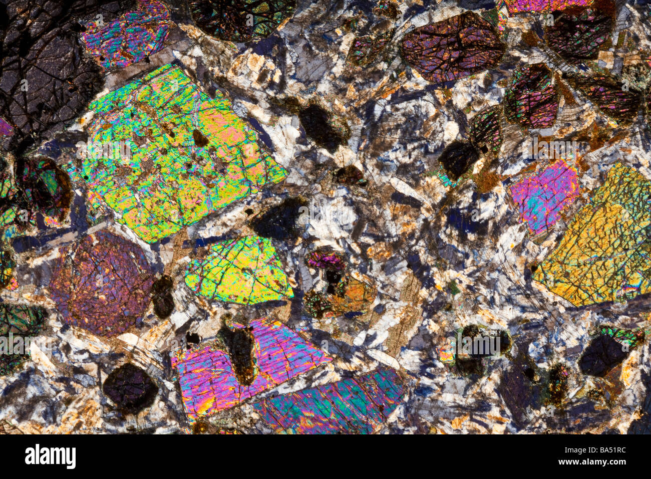 Mineral microscope slide section of Kentallenite rock using cross polarized  light illumination Stock Photo - Alamy
