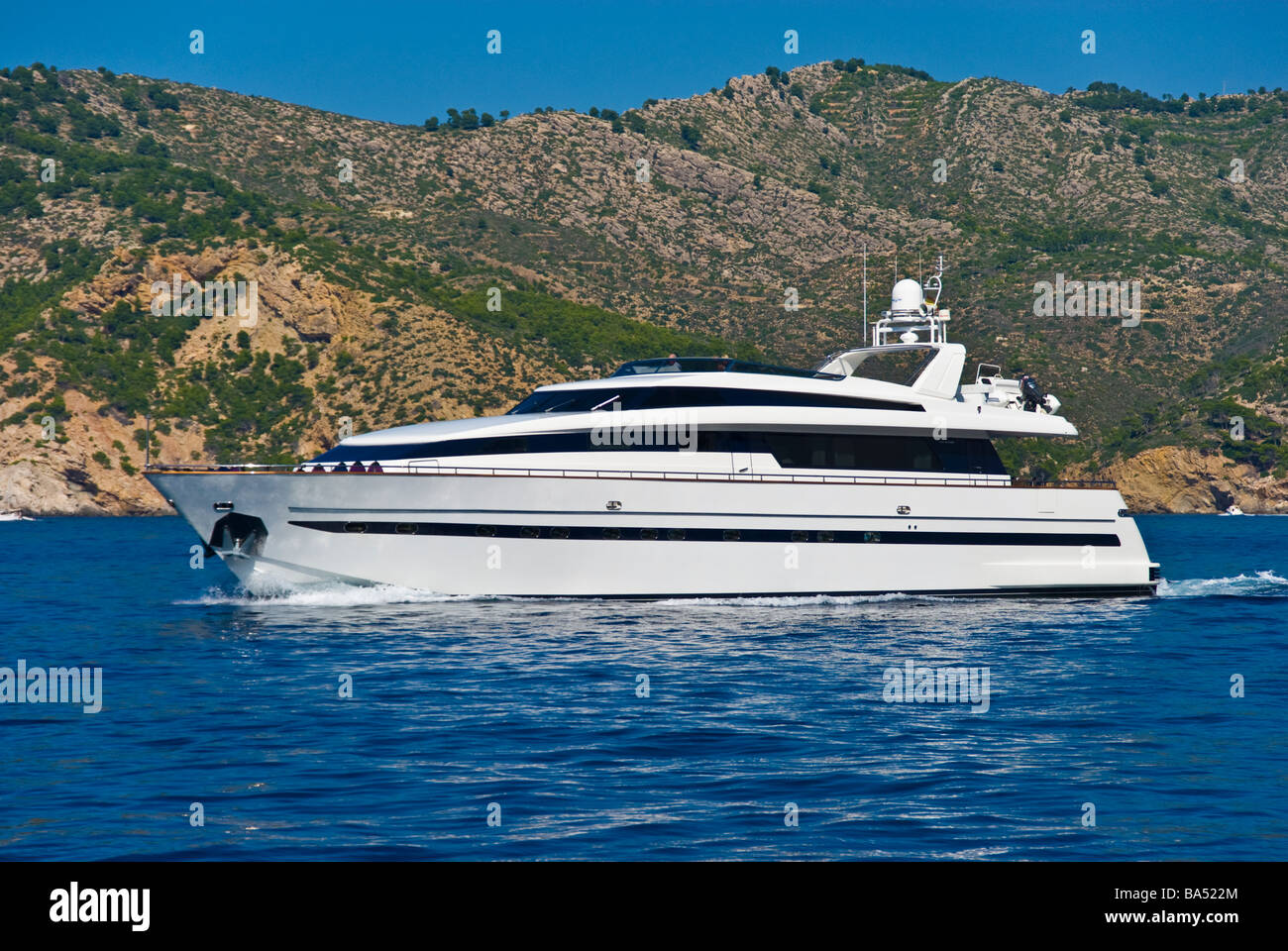 Super yacht cruising along the coast near Port Andratx Majorca Baleares Spain | Motoryacht kreuzt vor der Küste bei Port Antratx Stock Photo