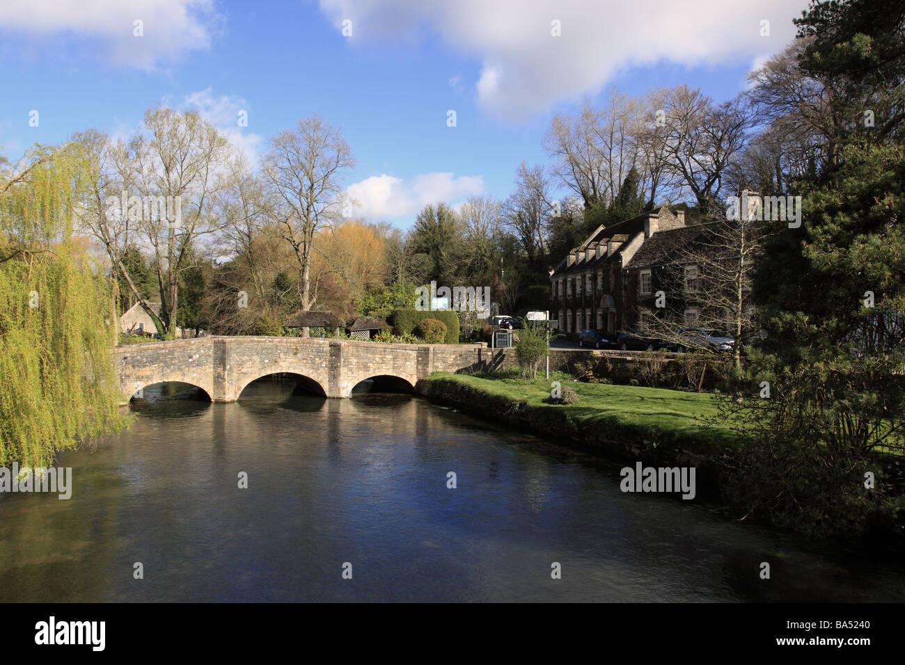 Bridge over the River Coln in the village of Bibury, The Cotswolds, Gloucestershire, England, UK Stock Photo