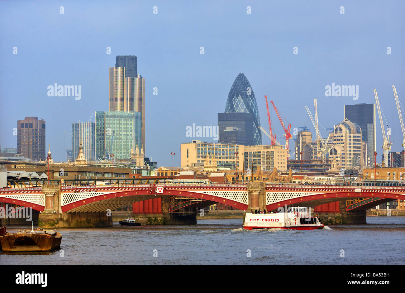 The city of London skyline with Blackfriars bridge in the forground and 30 St Mary Axe building (Gherkin) in the background. Stock Photo