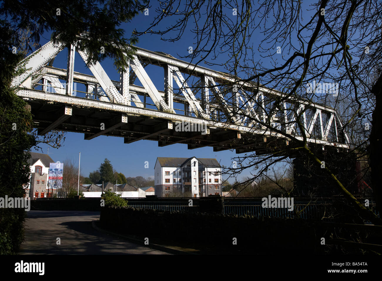 old metal iron bridge over a road bridge over a river in crumlin county