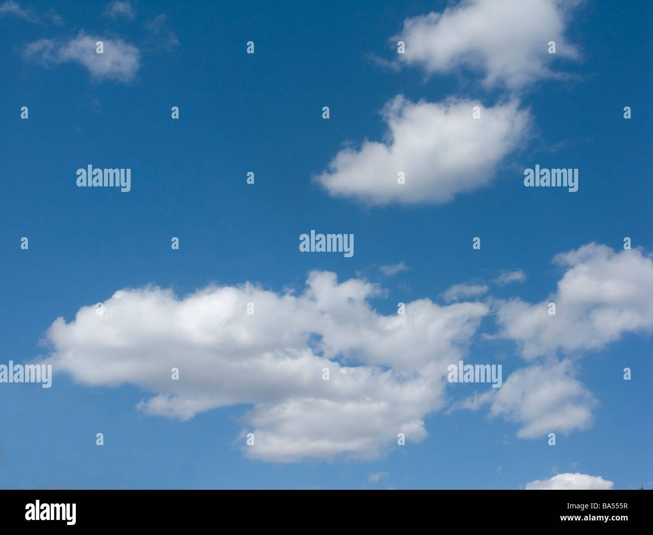 Cumulus Clouds in a Deep Blue Sky Stock Photo