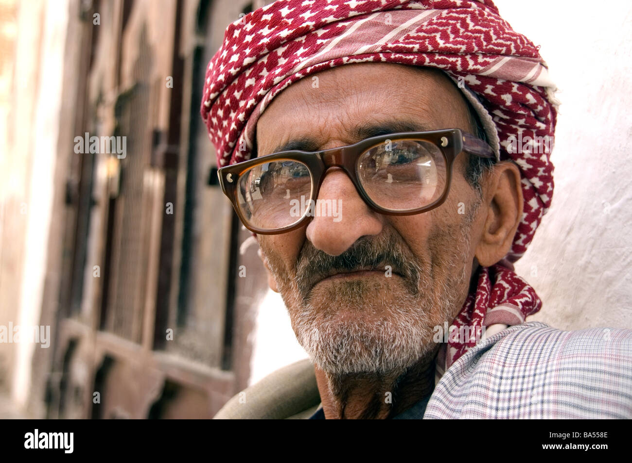 A close up of an old man s face in the old city of Sana a Yemen