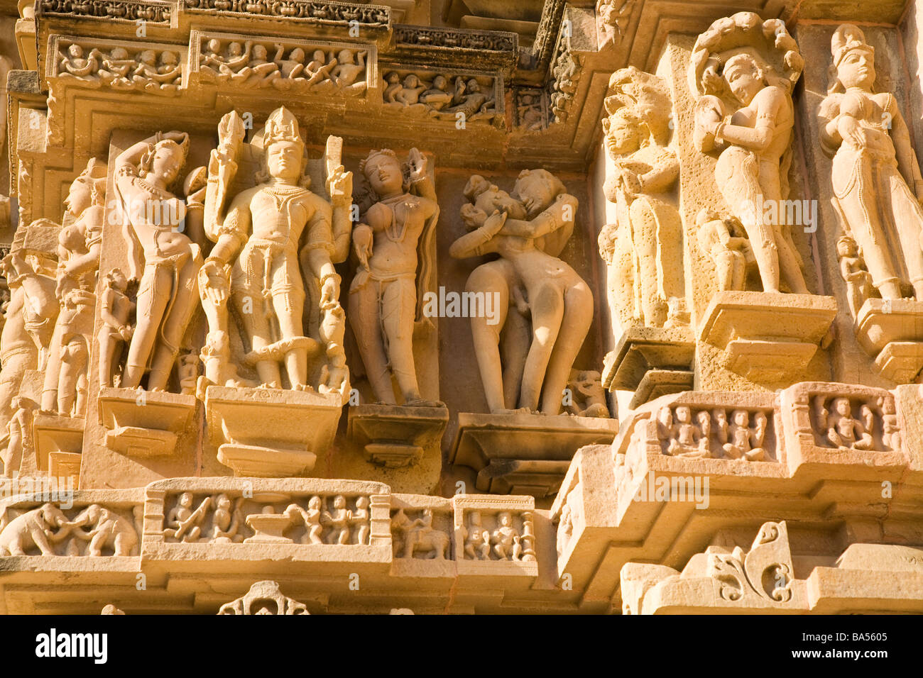 Exterior sandstone carvings Devi Jagadamba Jagadambi Temples Temple Khajuraho Unesco World Heritage Site Madhya Pradesh India Stock Photo