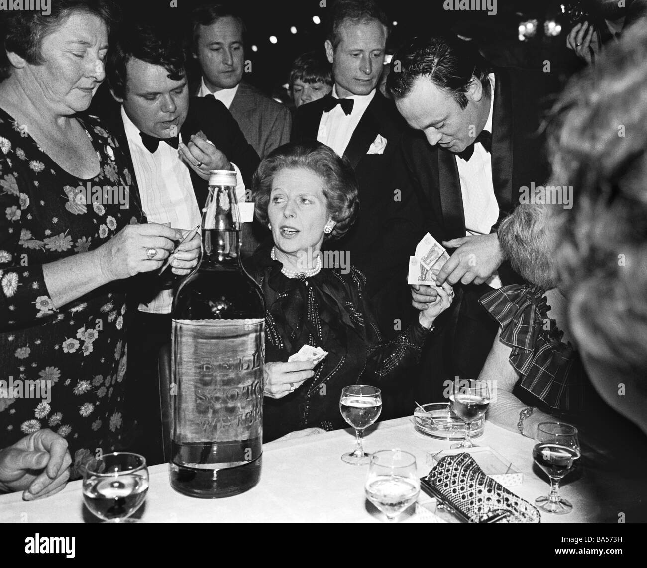 Margaret Thatcher Tory Prime Minister handing money to Tory Party member. Conservative Party Conference 1983 Stock Photo