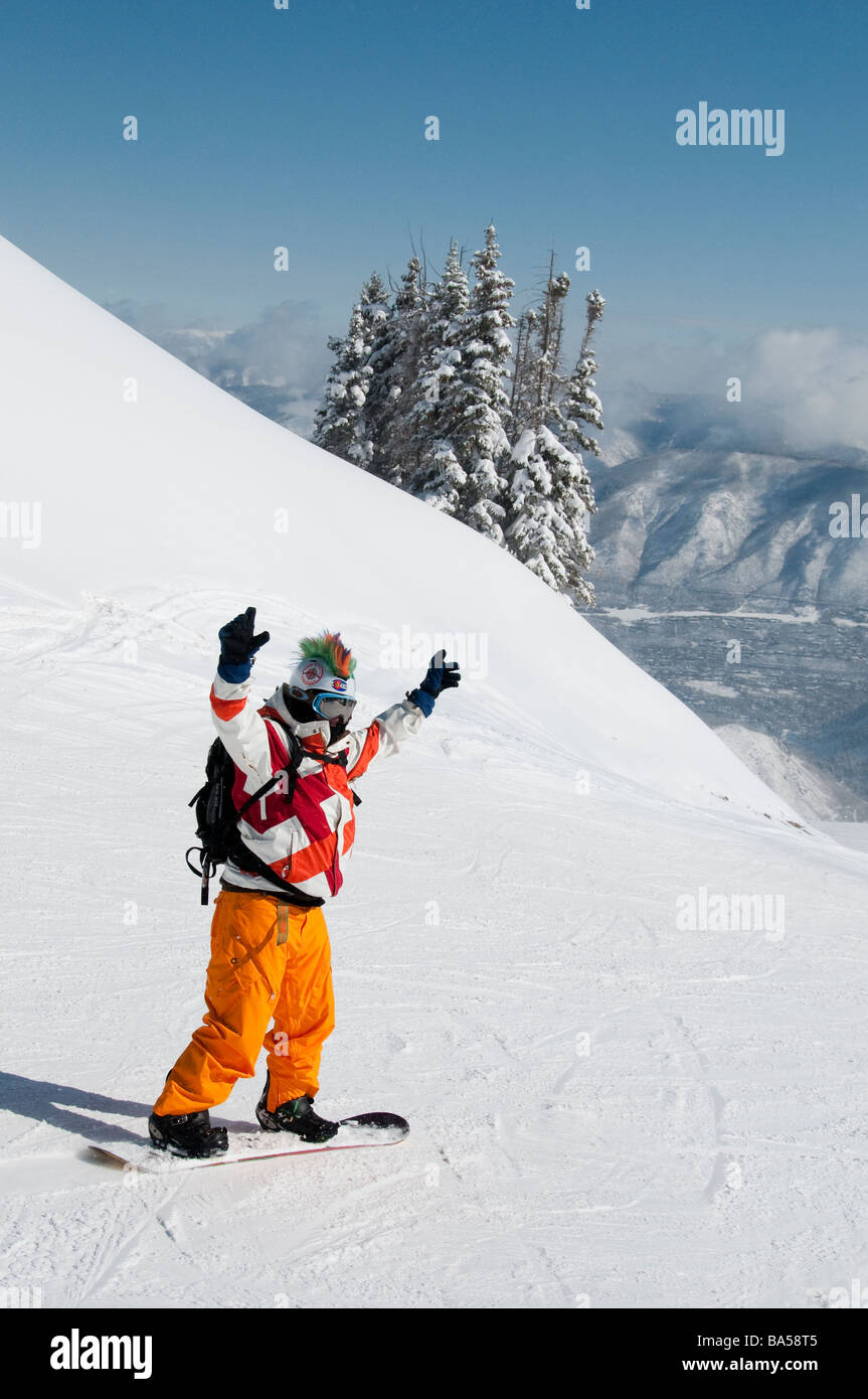 Snowboarder in colorful attire top of the Loge Peak Lift, Aspen Highlands Ski Area, Aspen, Colorado. Stock Photo