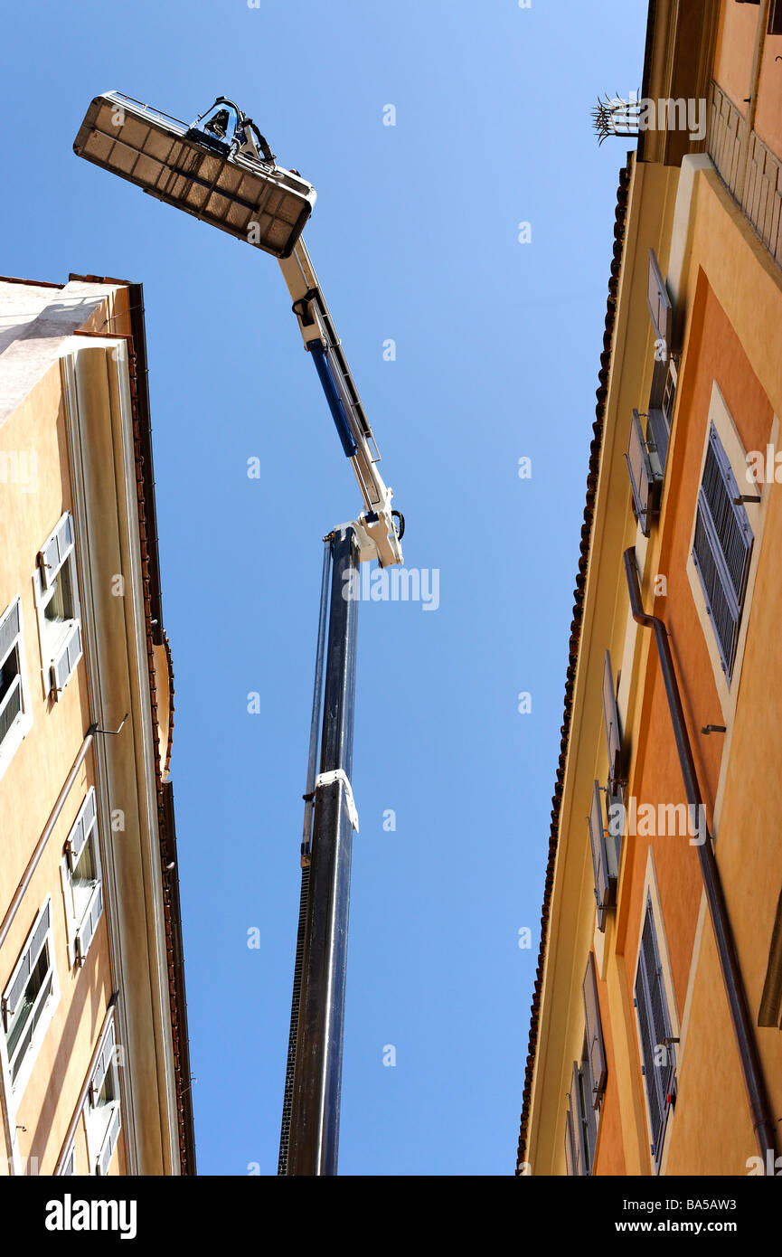 Sky lift engaged on repairs in Narrow street near Piazza Navona Rome Stock Photo