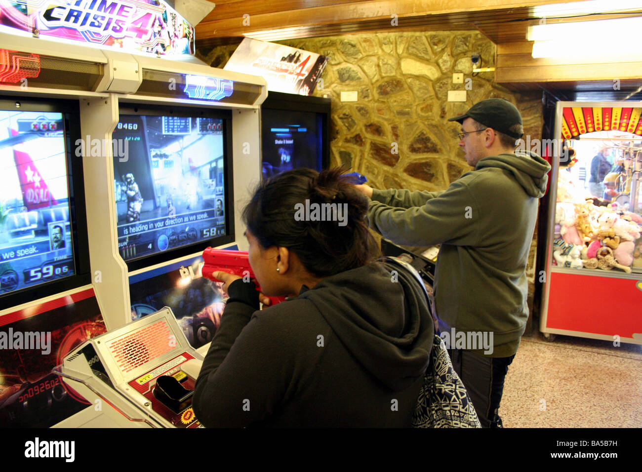 People Playing in an Amusement Arcade Stock Photo - Alamy