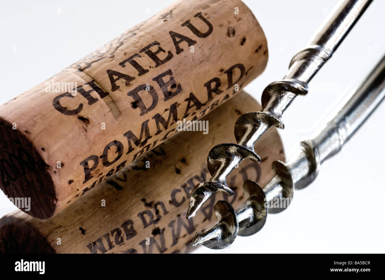 Chateau de Pommard cork and corkscrew on reflective surface Stock Photo